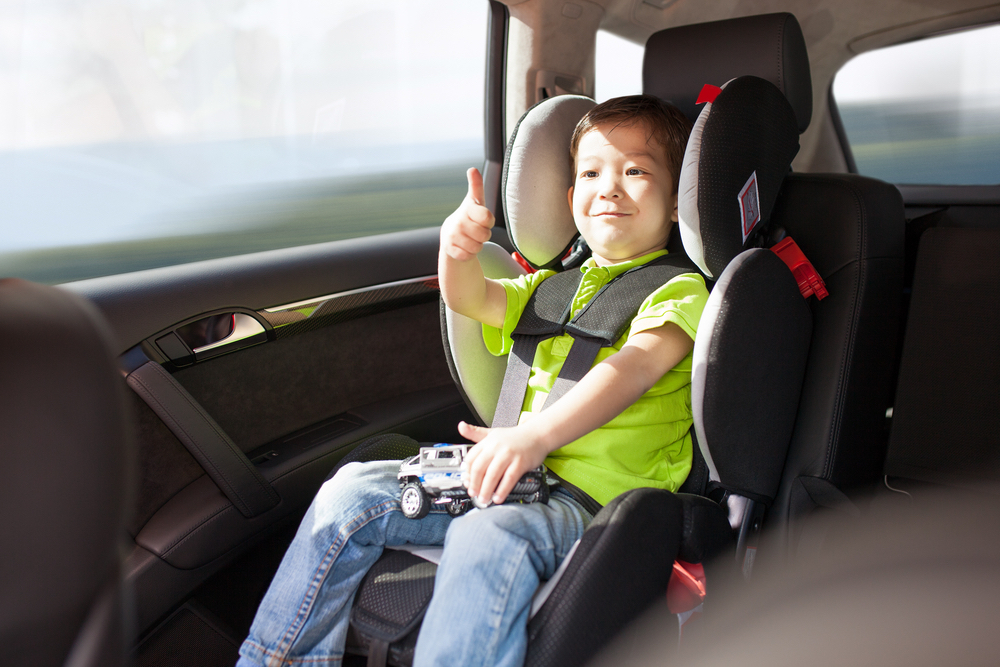 Travel Car Seat Expert - A child in the best travel booster seat.