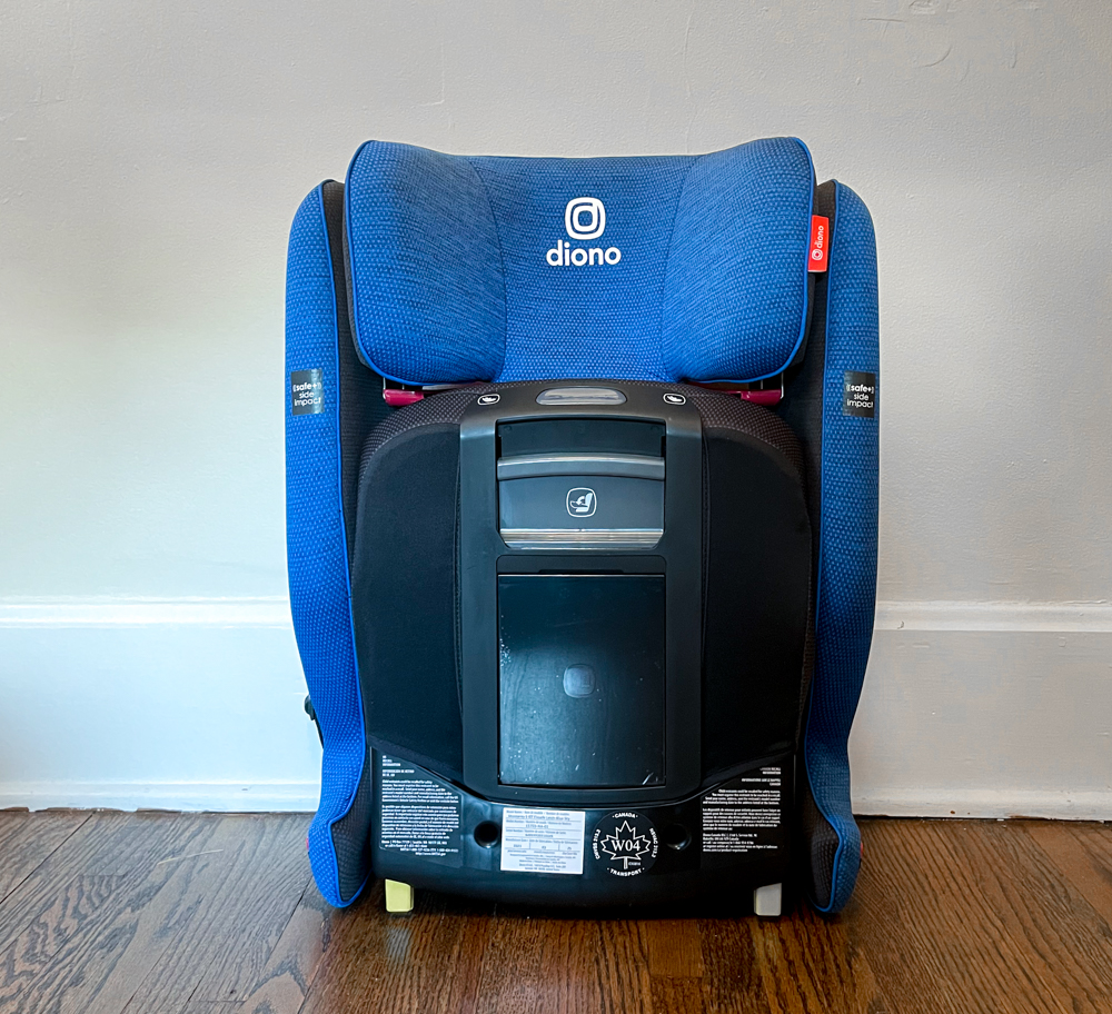 Travel Car Seat Expert - A blue car seat on a wooden floor.