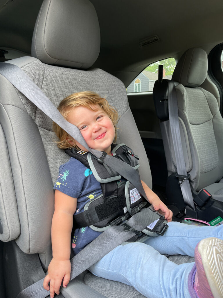 Travel Car Seat Expert - A little girl sitting in a car seat.