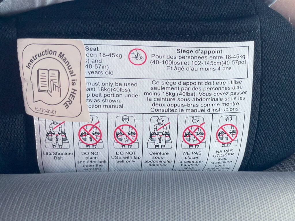 Travel Car Seat Expert - The back of a car seat with a label on it.