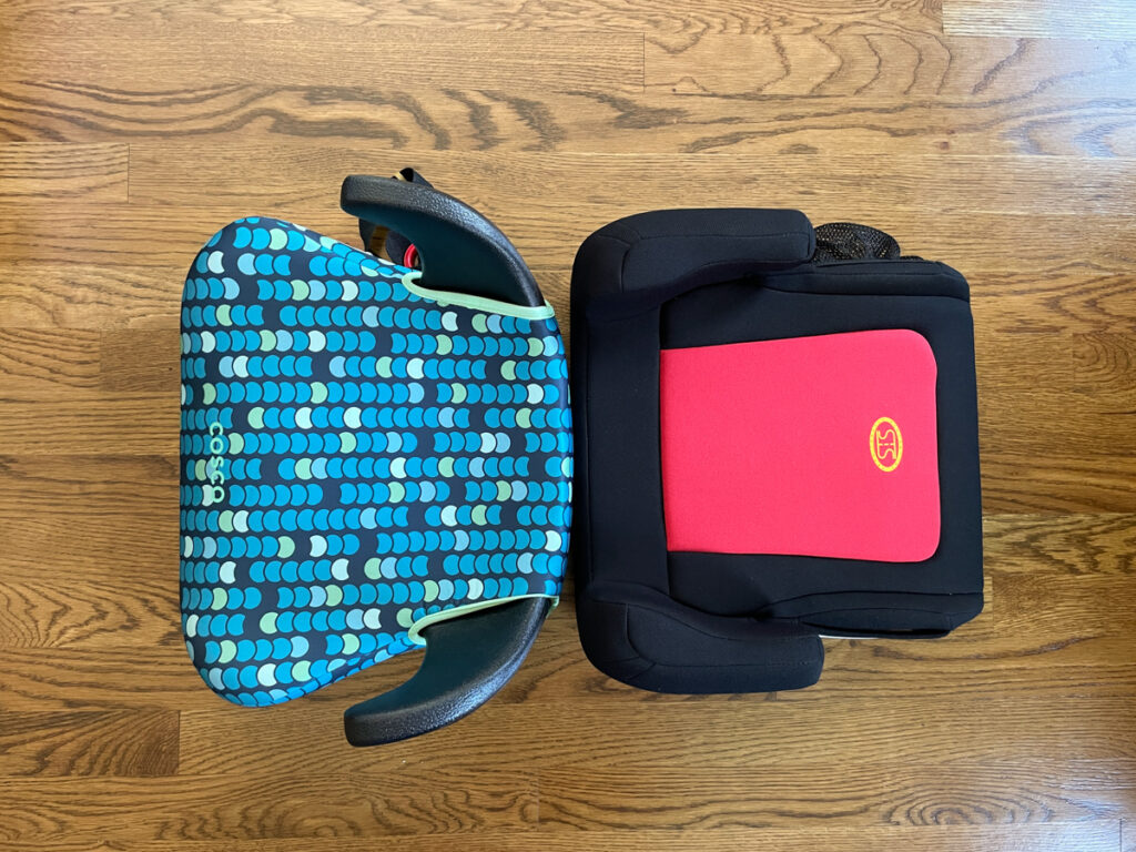 Travel Car Seat Expert - A child's car seat on a wooden floor.