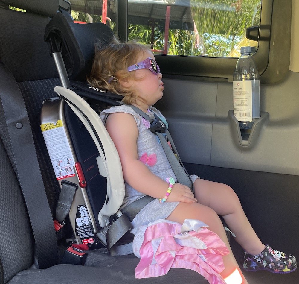 Travel Car Seat Expert - A little girl sleeping in a car seat while Wayb Pico is expertly reviewed by traveling parents.